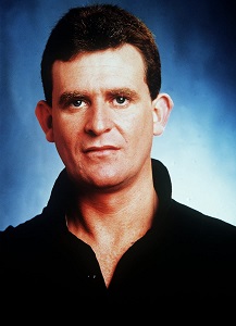 Des Clarke played by Paul Keane